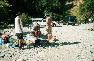 John inflates the raft.