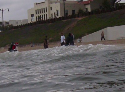 Just another day in Los Angeles... Santa Claus emerges from the ocean.
