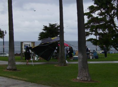 A gust of wind blows over one of the tents.