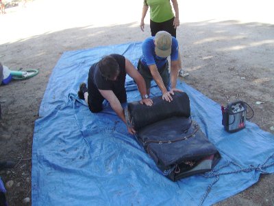 The ceremonial rolling up of the raft.
