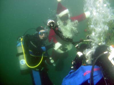 Divers pose with Santa.