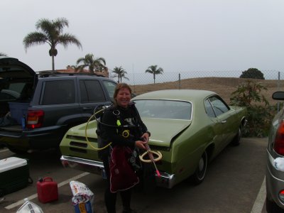 Spear fisherwoman Angelshark poses with her gun at the back of the Duster.