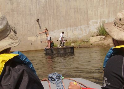 A chick dips her pole off of the Power House.