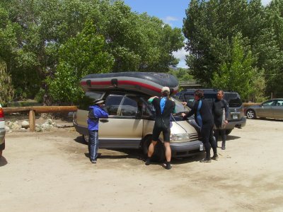 The raft is loaded onto the van.
