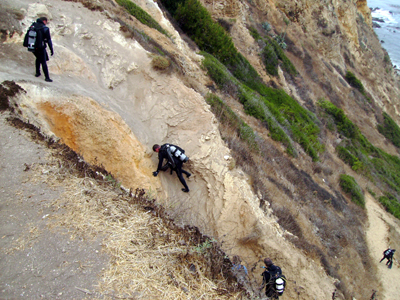 SCUBA Divers climb down Honeymoon Cove.